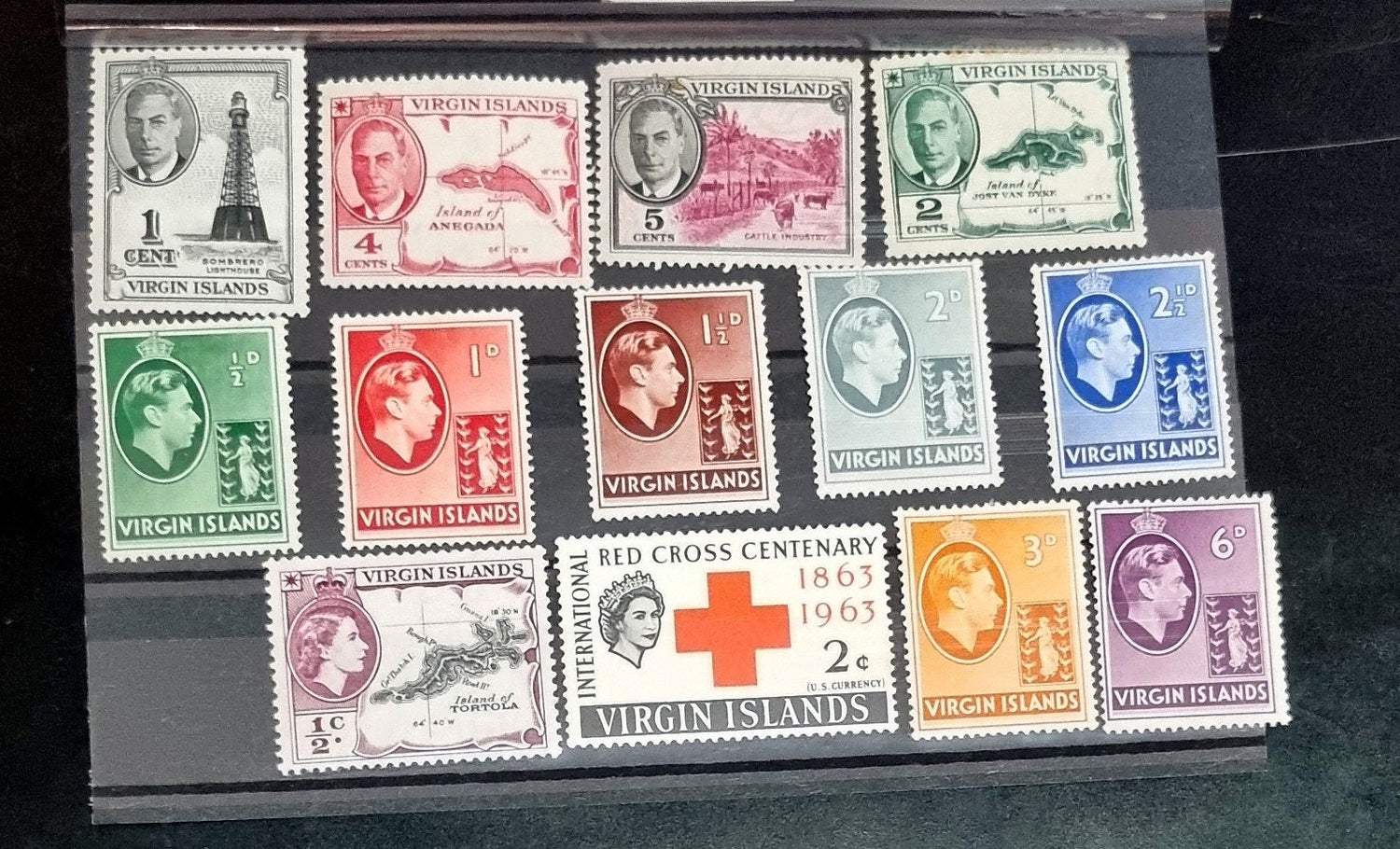 A collection of vintage postage stamps from the British Virgin Islands, featuring various designs and Queen Elizabeth II.
