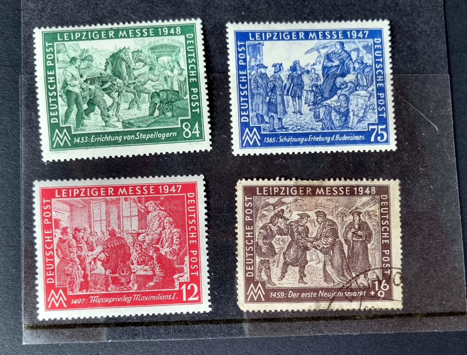 A selection of vintage German stamps from various regions and periods, displayed in a row.