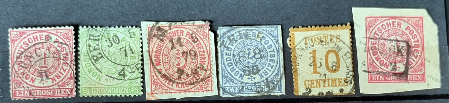 A selection of vintage German stamps from various regions and periods, displayed in a row.