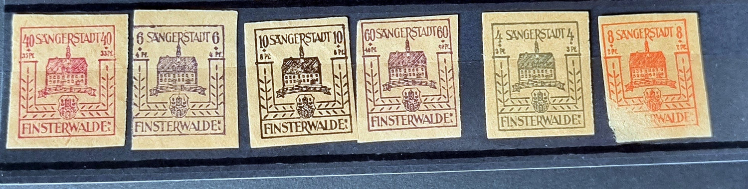 A selection of vintage German stamps from various regions and periods, displayed in a row.