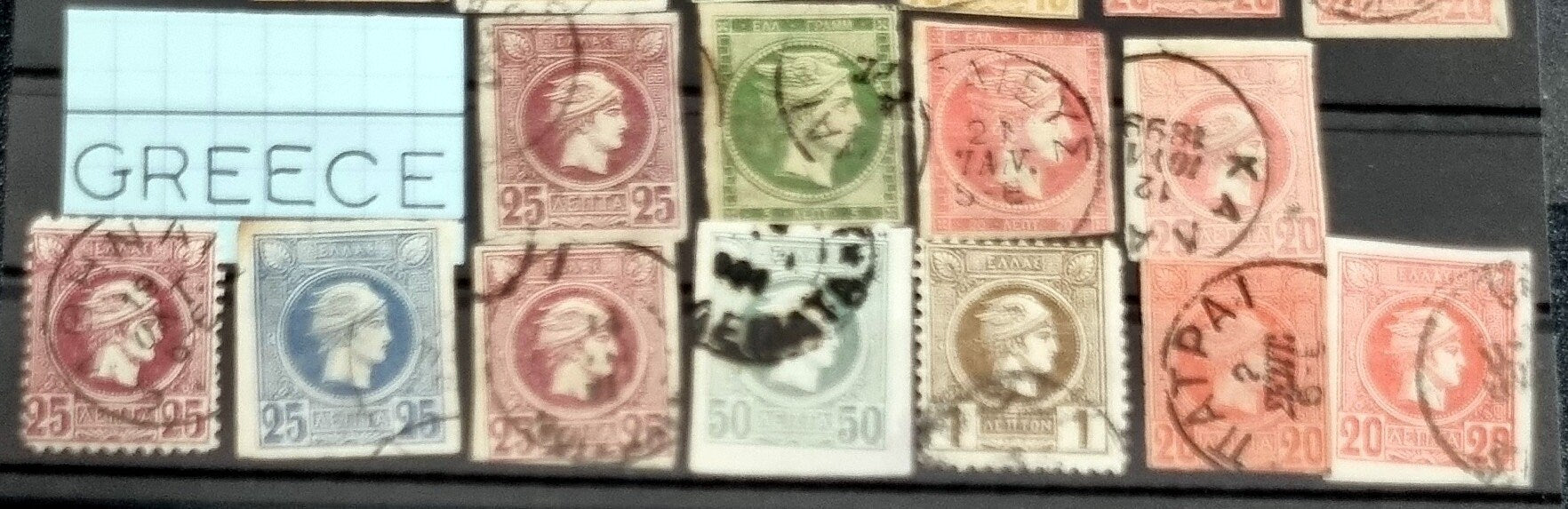 A collection of vintage Greek stamps, featuring different designs and colors, arranged side by side.