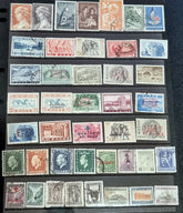A collection of vintage Greek stamps, featuring different designs and colors, arranged side by side.