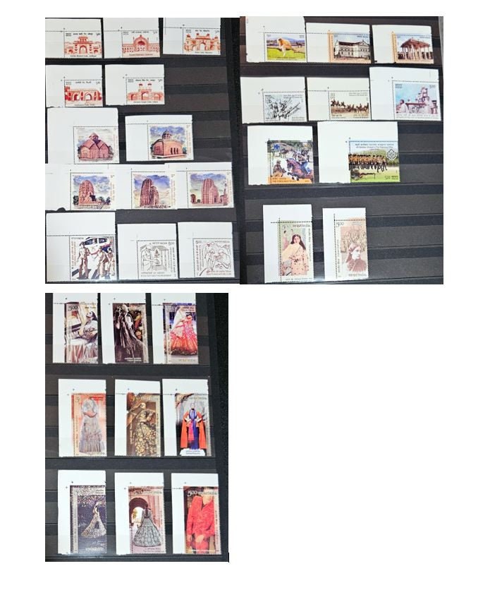 A set of vintage India postage stamps displayed in a row, showcasing various designs including portraits and images of animals and flowers.