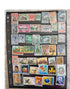 A collection of various Ceylonese postage stamps displayed in a row, showcasing different designs and colors.