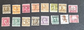 A collection of vintage USA postage stamps with various overprints and cancellations.
