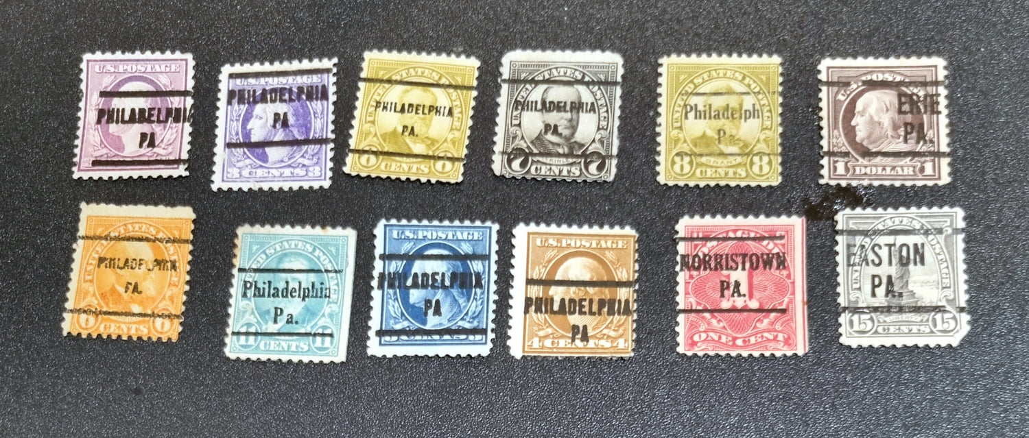 A collection of vintage USA postage stamps with various overprints and cancellations.