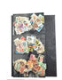 A collection of various postage stamps arranged in a pile, featuring different colors and designs, with no duplicates.