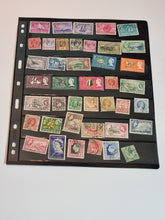 A collection of various postage stamps arranged in a pile, featuring different colors and designs, with no duplicates.