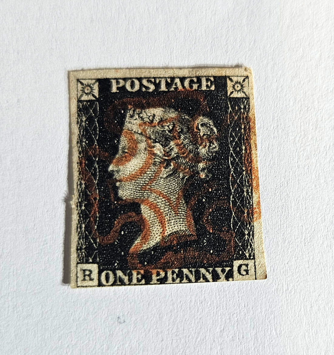 A postage stamp featuring Queen Victoria with the inscription &