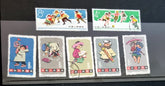 A collection of various Chinese stamps arranged in rows, showcasing different designs and colors.