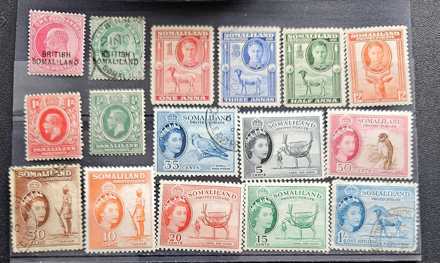 A collection of vintage Somalia postage stamps displayed on a black background, featuring multiple colors and denominations.