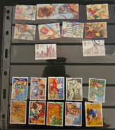 Collection of vintage stamps on a black page