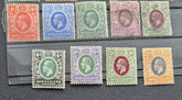 A set of ten vintage Somaliland postage stamps from the British Empire, featuring various colors including red, blue, green, purple, orange, and brown, arranged on a black textured surface.