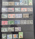 A collection of vintage Nyaaland postage stamps displayed on a black plastic mounting sheet, showing various denominations and colors including green, blue, red, purple, and brown.