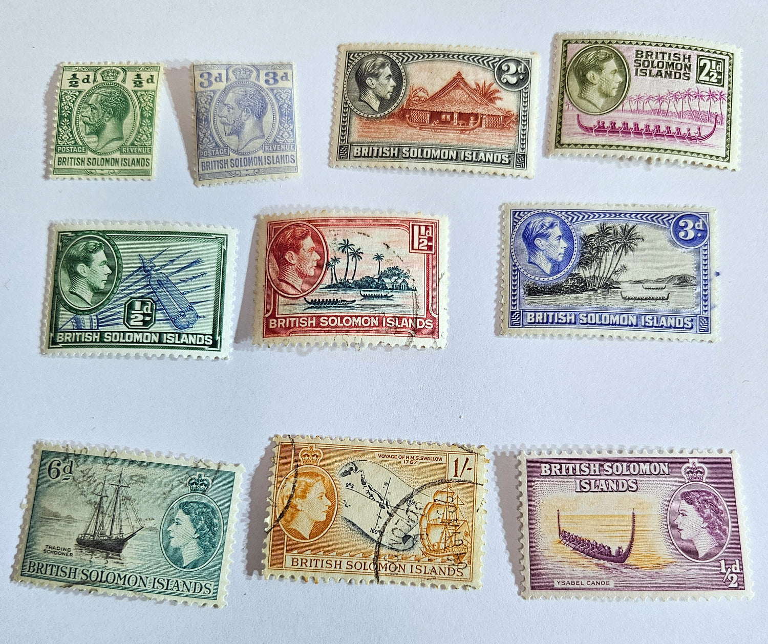A collection of vintage Solomon Islands stamps featuring various designs, colors, and themes, including historical figures and landscapes.