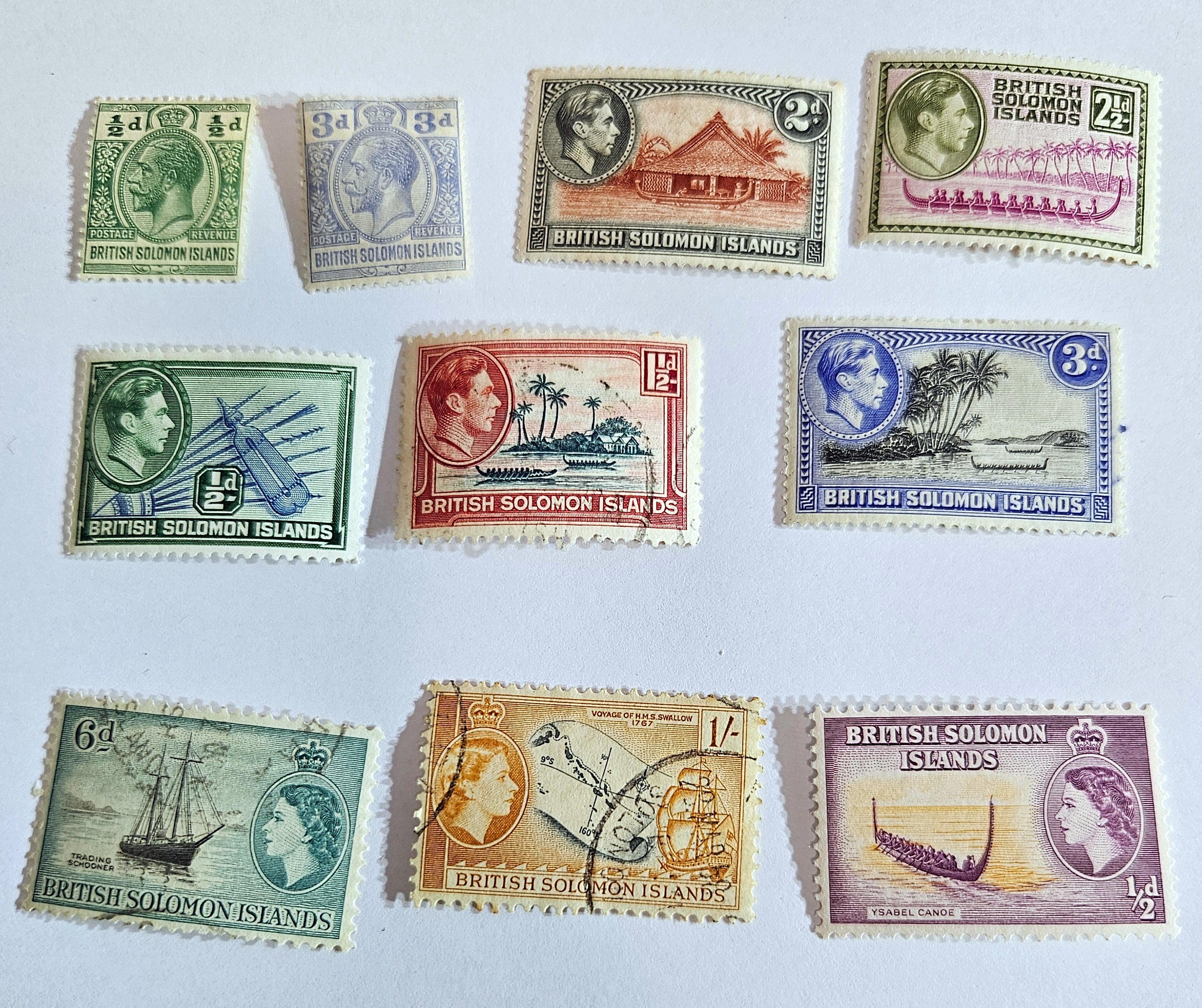 A collection of vintage Solomon Islands stamps featuring various designs, colors, and themes, including historical figures and landscapes.