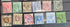 A collection of vintage postage stamps from the Straits Settlements, featuring various colors and designs, displayed on a flat surface.