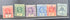 Six vintage postage stamps from the British Gilbert, displayed side-by-side on a dark background. The stamps feature various colors including red, green, purple, blue, orange, and gray, with some showing cancellation marks.