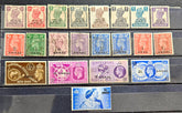 A collection of vintage Muscat Oman postage stamps arranged on a dark stack