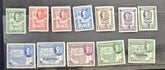 A set of vintage Somali postage stamps arranged in two rows on a dark background. The top row contains seven stamps in green, red, blue, tan, purple, and lavender shades, while the bottom row contains six additional stamps in blue, tan, green, and lavender tones.