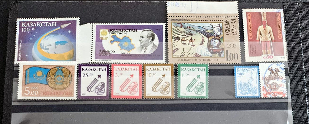 Collection of Kazakhstan stamps on a display sheet