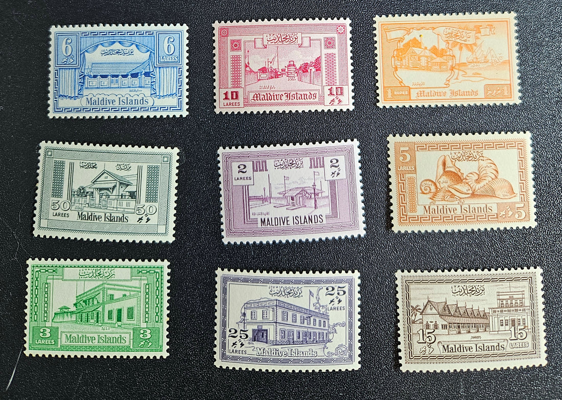 A collection of vintage postage stamps from Maldives Islands, featuring various designs and denominations, displayed on a dark background.