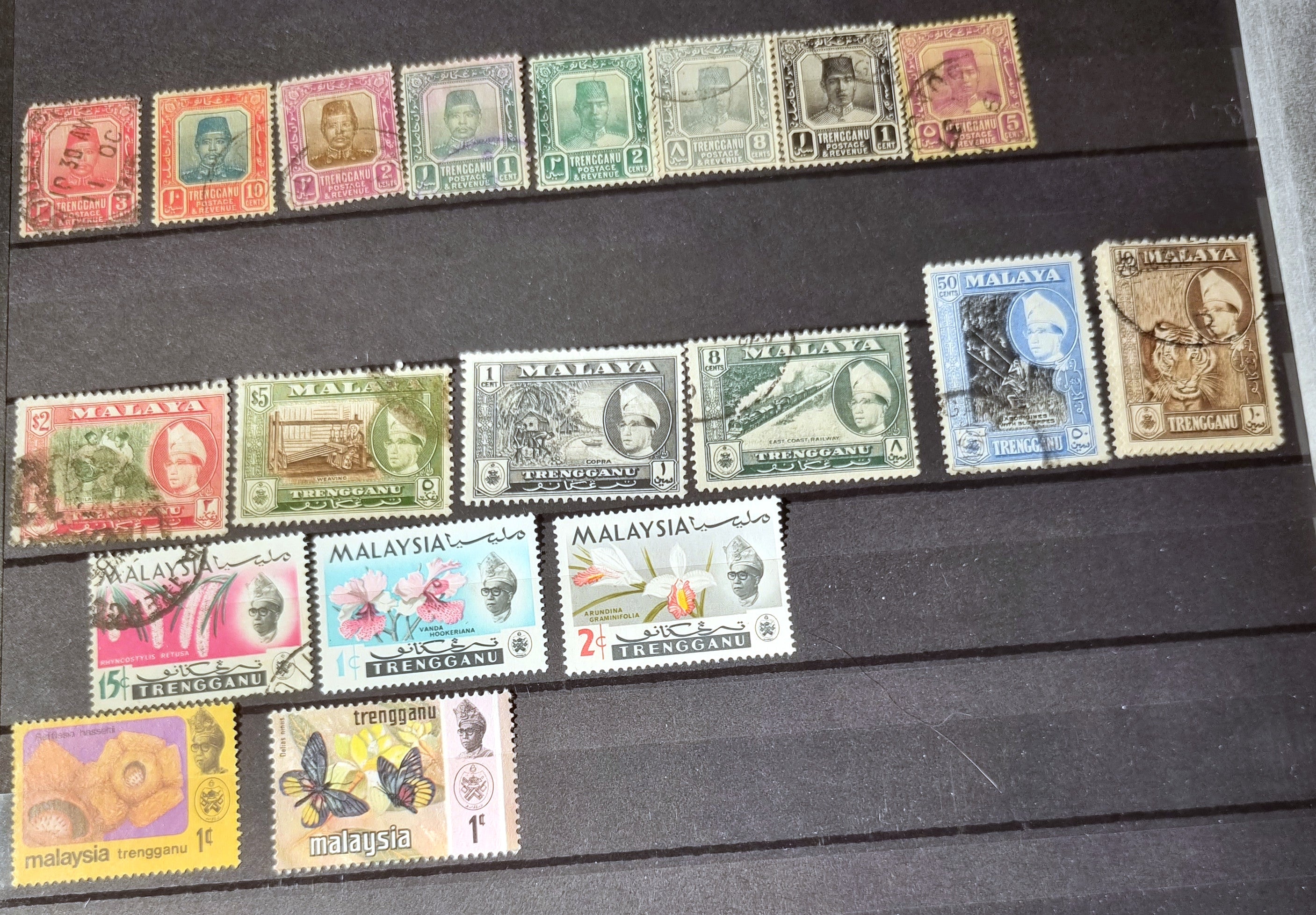 A collection of various vintage Malay state stamps