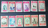 Collection of vintage stamps with different designs and colors on a dark background.