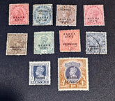 A set of nine vintage Indian Nabha State postage stamps from the British Raj, displayed on a dark textured background. The stamps feature various colors including pink, blue, green, brown, and orange, with &