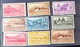 Collection of vintage stamps with various designs and colors on a dark background