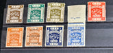 A collection of vintage Palestine postage stamps from 1918-1921 with various designs and colors, displayed in a row.