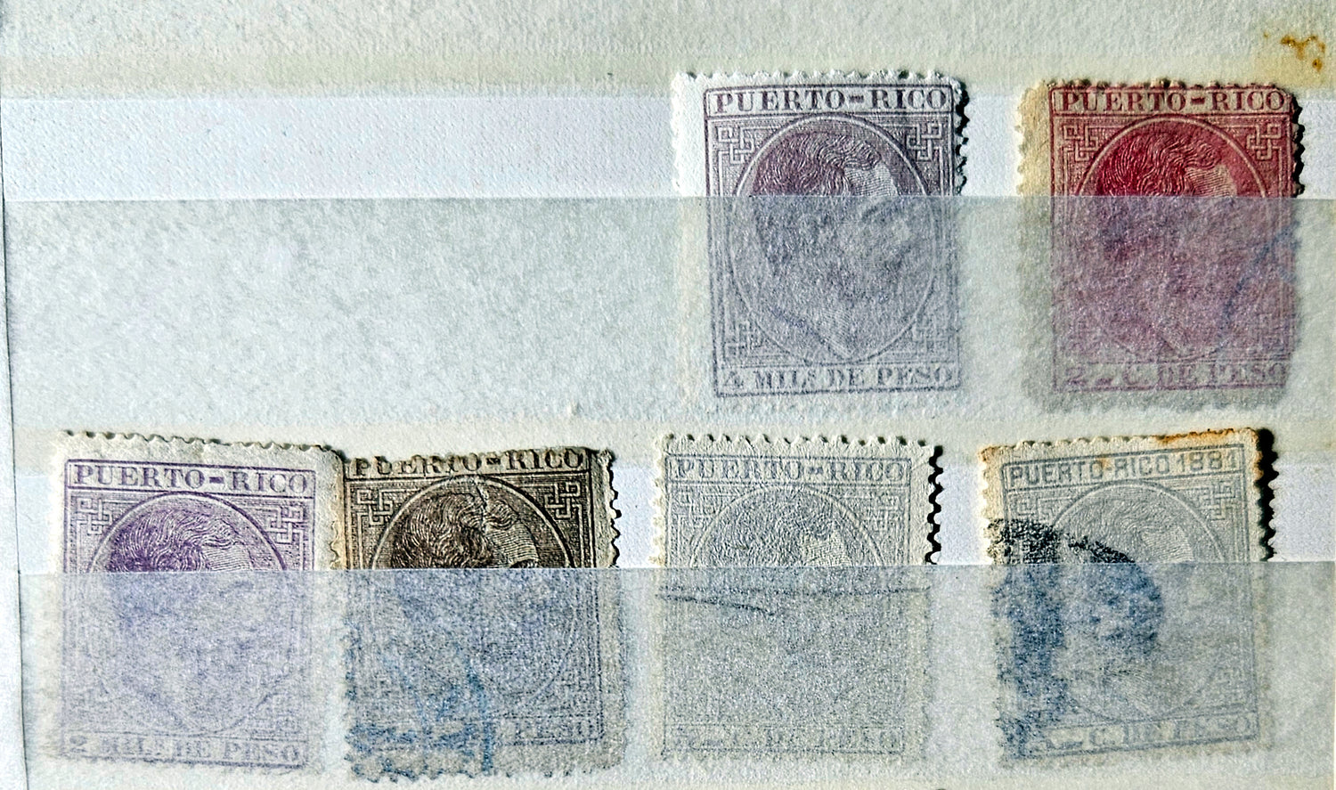 Collection of vintage Puerto Rico stamps on a textured surface
