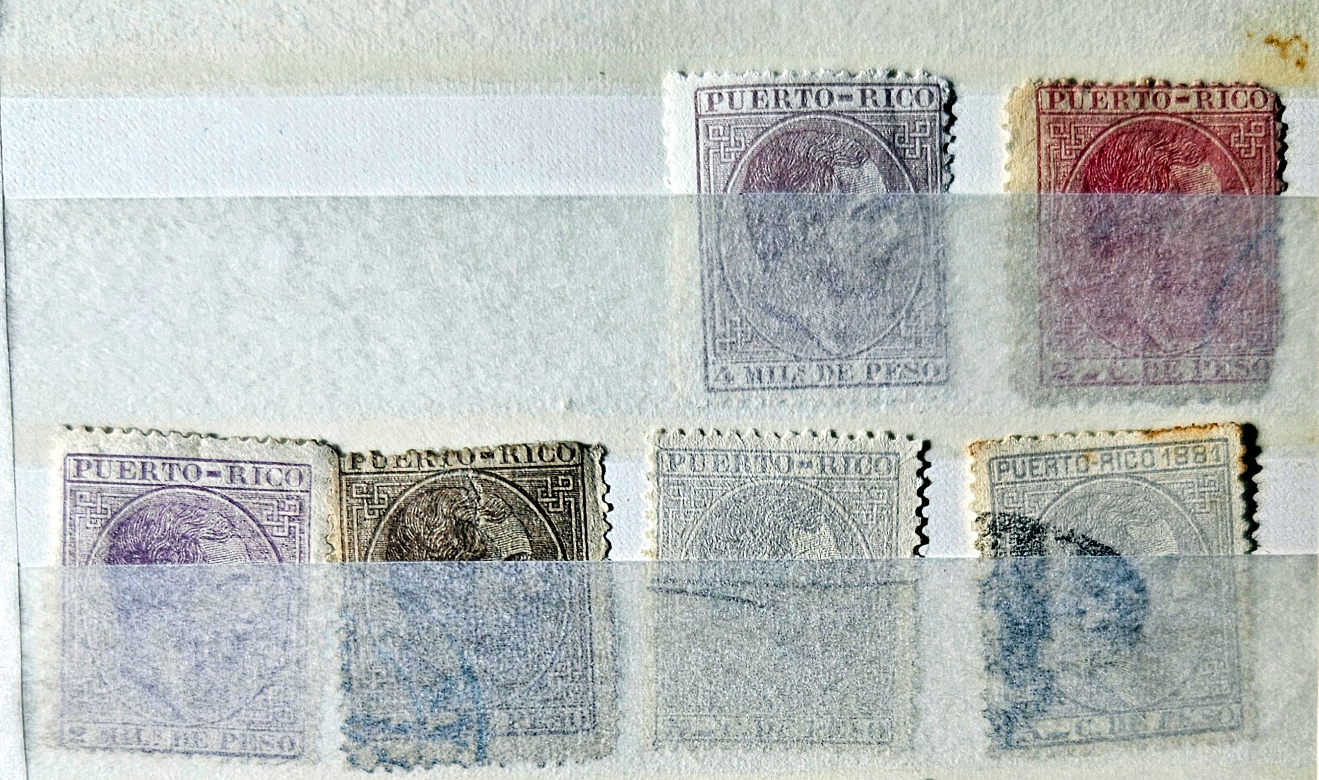 Collection of vintage Puerto Rico stamps on a textured surface