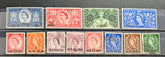 A set of vintage Queen Elizabeth II postage stamps from the United Kingdom, arranged in two rows on a dark textured background. 