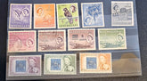 A set of vintage Seychelles postage stamps displayed inside a clear plastic protective sleeve, arranged in three rows on a dark textured surface.