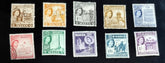 A collection of vintage postage stamps from Malta featuring various designs and colors, arranged in no specific order on a surface.
