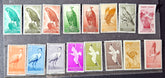 Collection of vintage stamps with various designs on a display album.