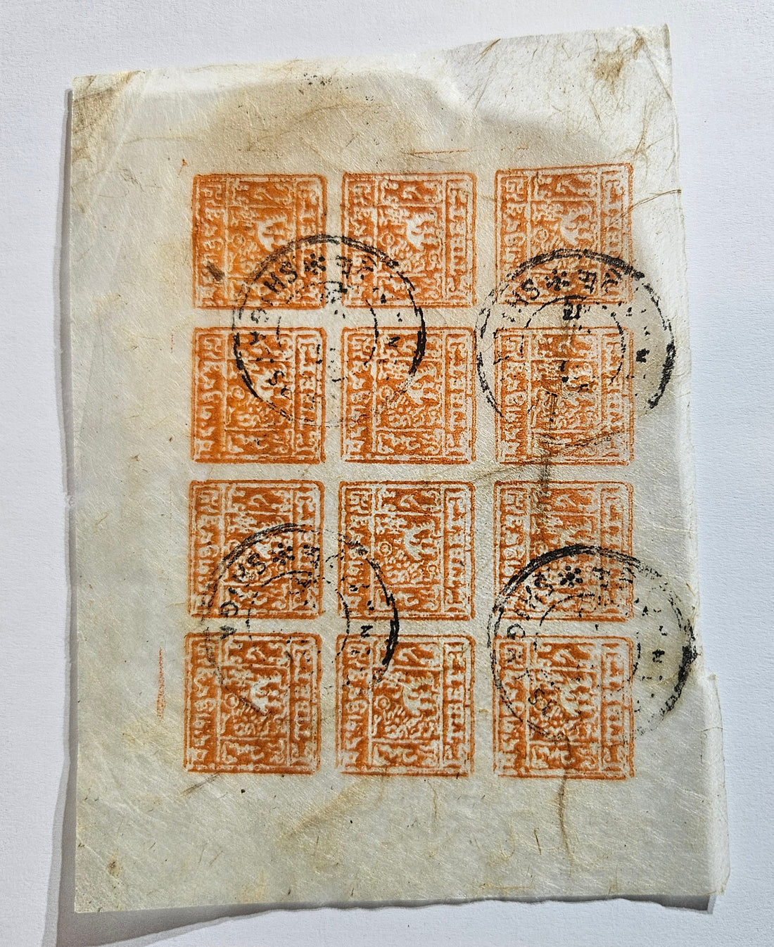 A close-up of a Tibet postage stamp showing intricate designs and the postage stamp&