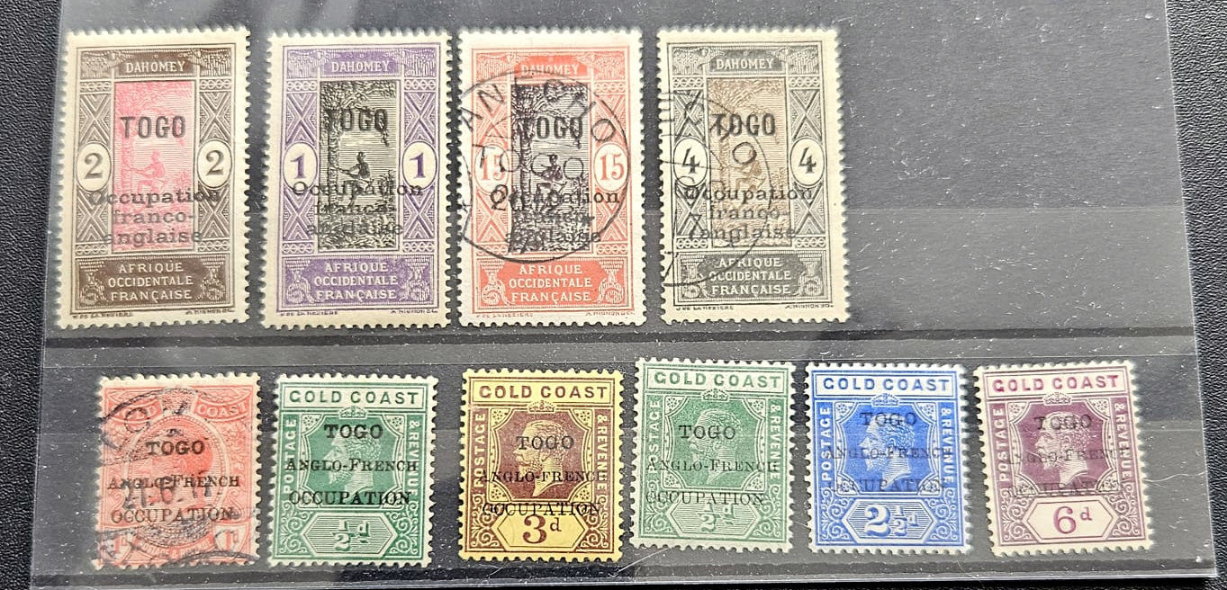 A set of vintage Togo and Gold Coast occupation stamps displayed on a black background, featuring multiple colors and cancellation marks.