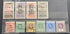 A set of vintage Togo and Gold Coast occupation stamps displayed on a black background, featuring multiple colors and cancellation marks.