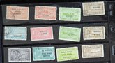 A collection of various Indian postage stamps displayed in a row, showcasing different colors and designs.