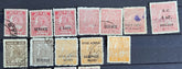 A collection of various Indian postage stamps displayed in a row, showcasing different colors and designs.