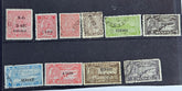 A collection of various Indian postage stamps displayed in a row, showcasing different colors and designs.