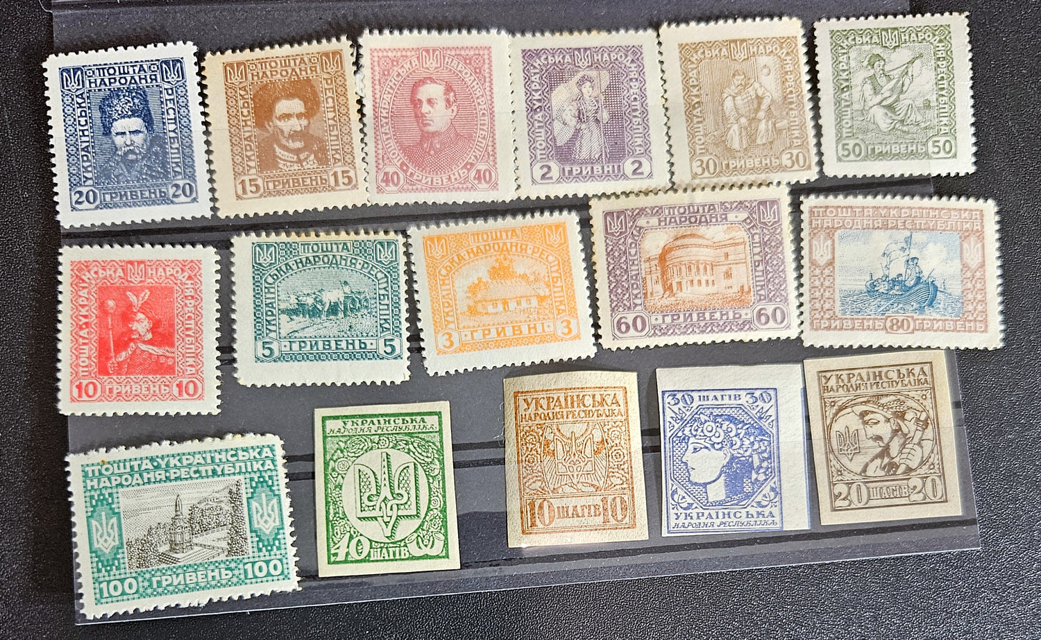 A collection of vintage stamps from Ukraine, showcasing various designs and denominations, displayed on a transparent background.