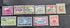 A set of ten vintage Western Samoa postage stamps displayed on a dark textured background, featuring various colors and designs with country names printed on them.