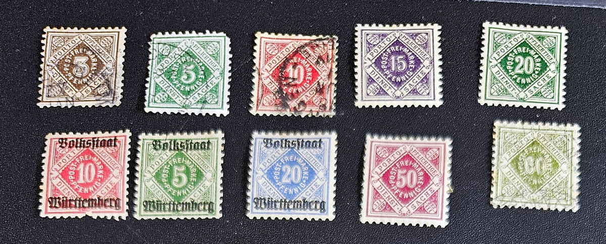 Ten vintage German postage stamps from Wurttemberga rranged in two rows on a black background. The stamps feature various denominations including 5, 10, 15, 20, 50, and 60 Pfingte, printed in green, red, blue, purple, and brown with postmark cancellations.
