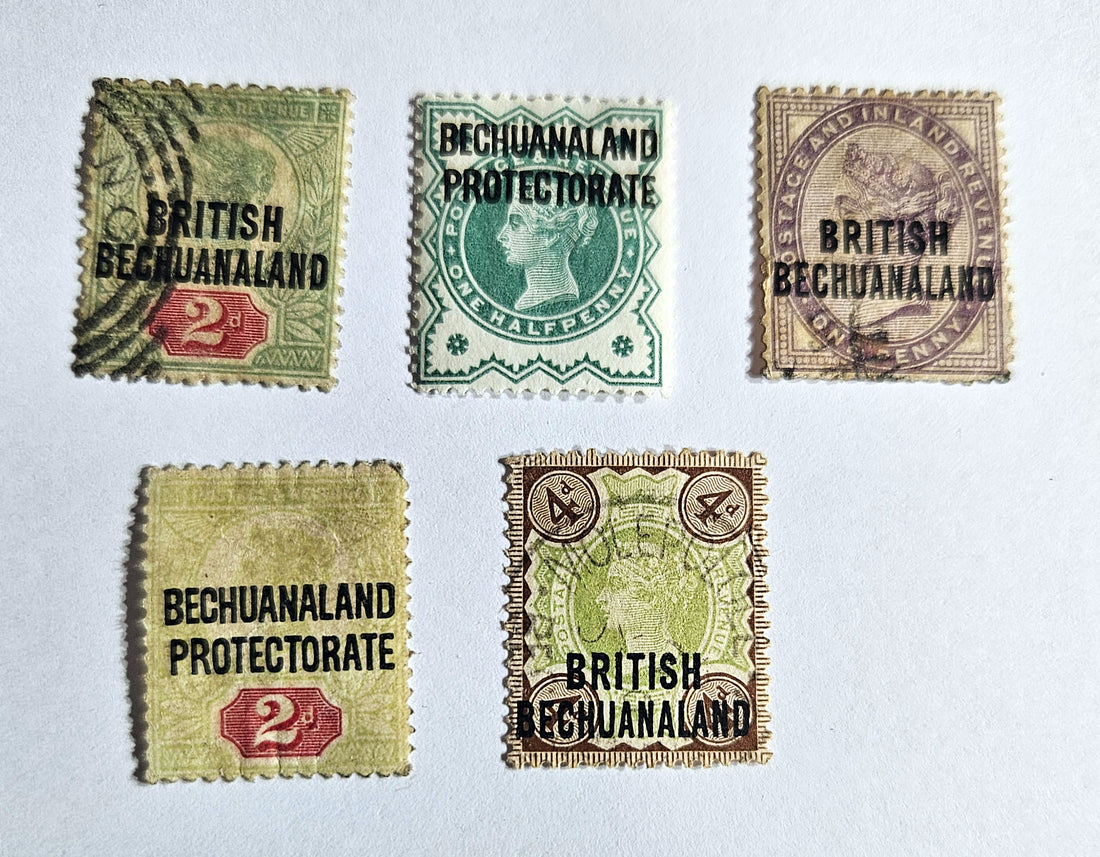 A collection of vintage British Commonwealth Bechuanaland Protectorate stamps featuring various denominations and kings from the reign of George V to Elizabeth II.