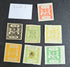 A collection of vintage postage stamps from various Feudatory States of India, featuring different colors and designs, placed on a flat surface.