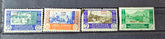 Five vintage stamps from Morocco with different designs and colors on a black background.