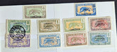 A collection of vintage French Cameroon stamps displayed on a surface, featuring various colors and designs.
